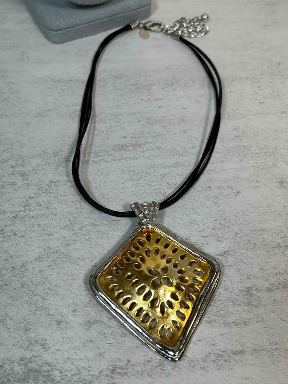 Chico's Gold and Silver Sunburst Pendant Necklace with Black Multi-Strand Cord